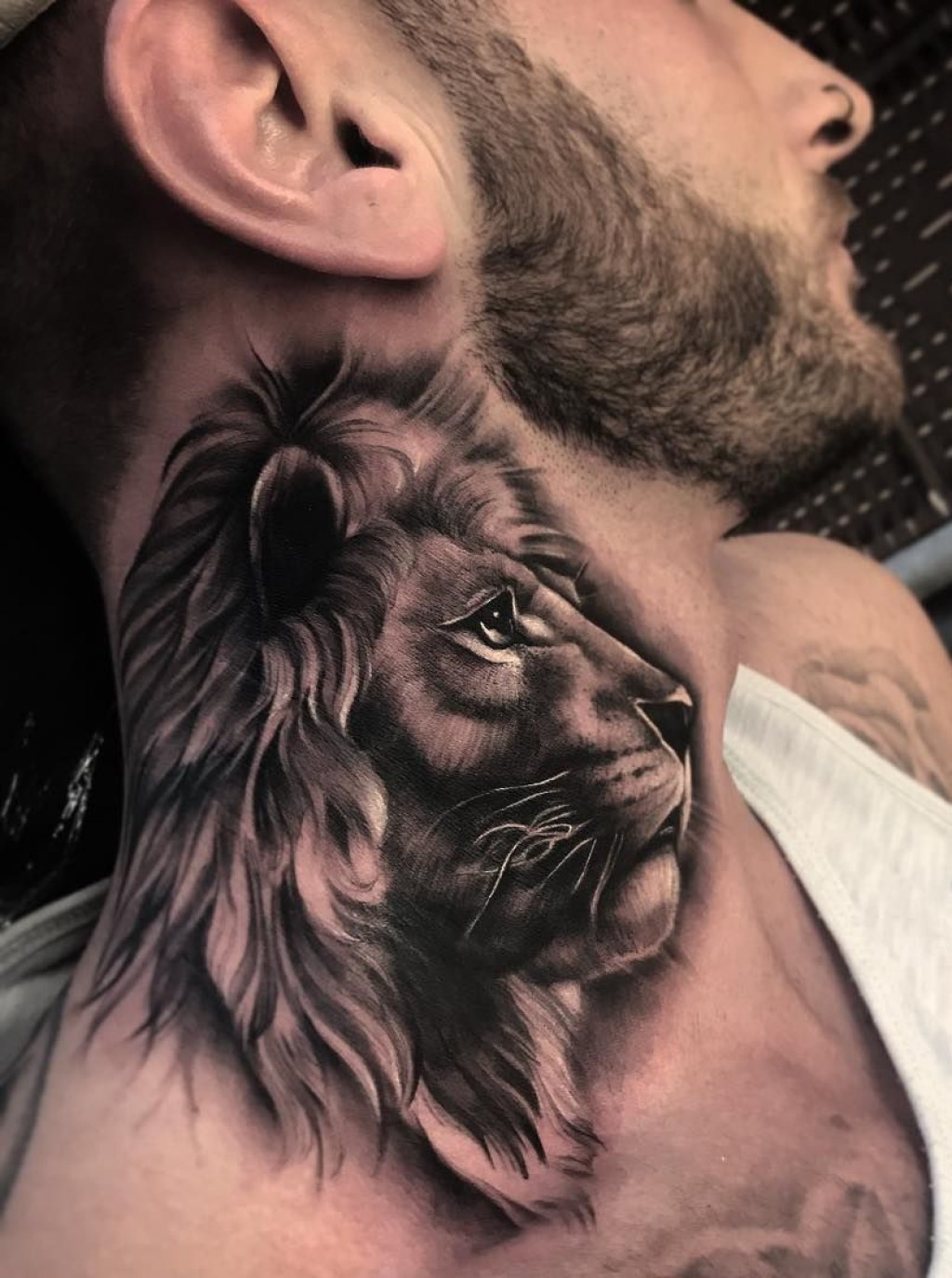 Picture of: cool lion neck tattoo © tattoo artist Bobby Loveridge